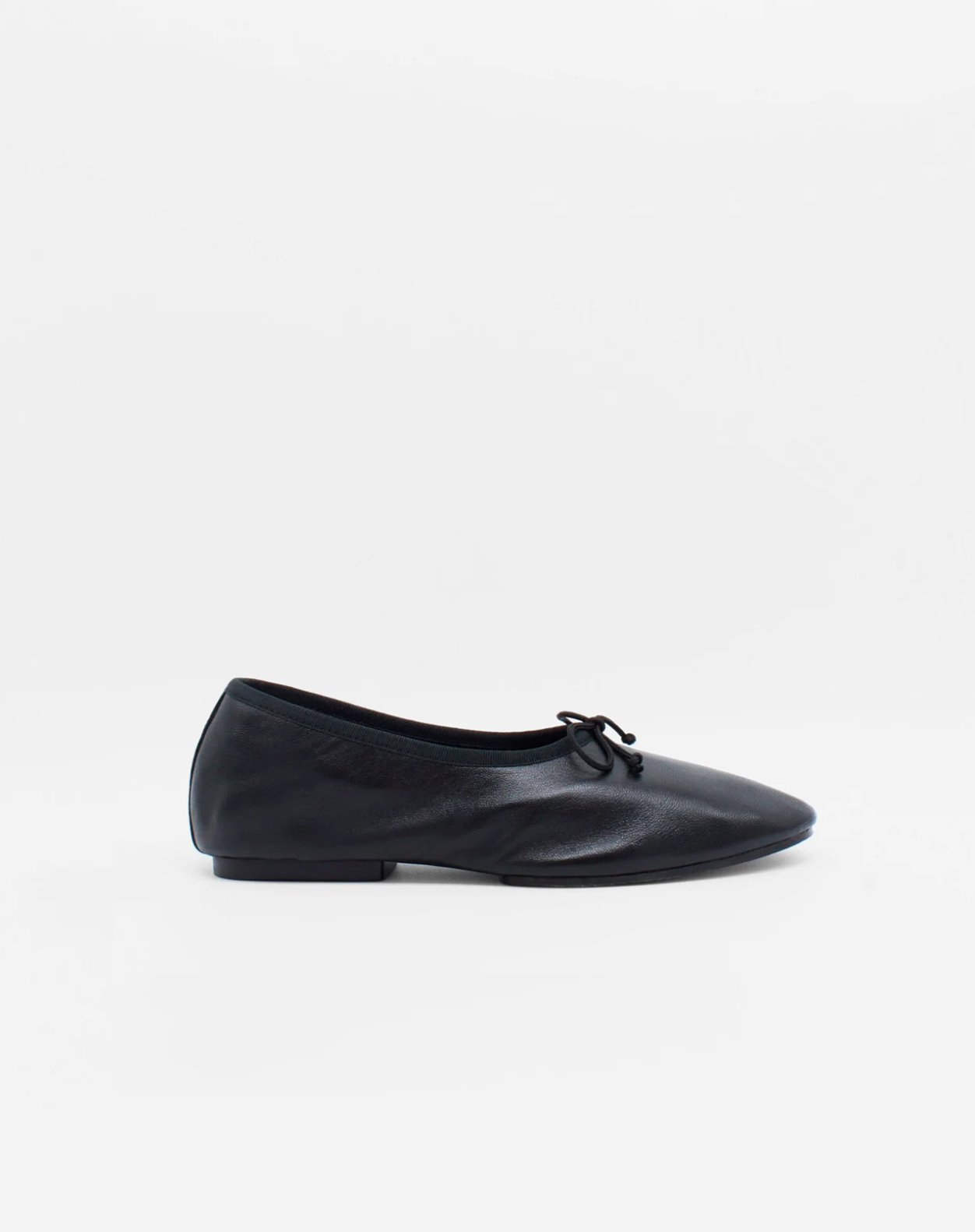 About Arianne Mila Black ballet flat side profile