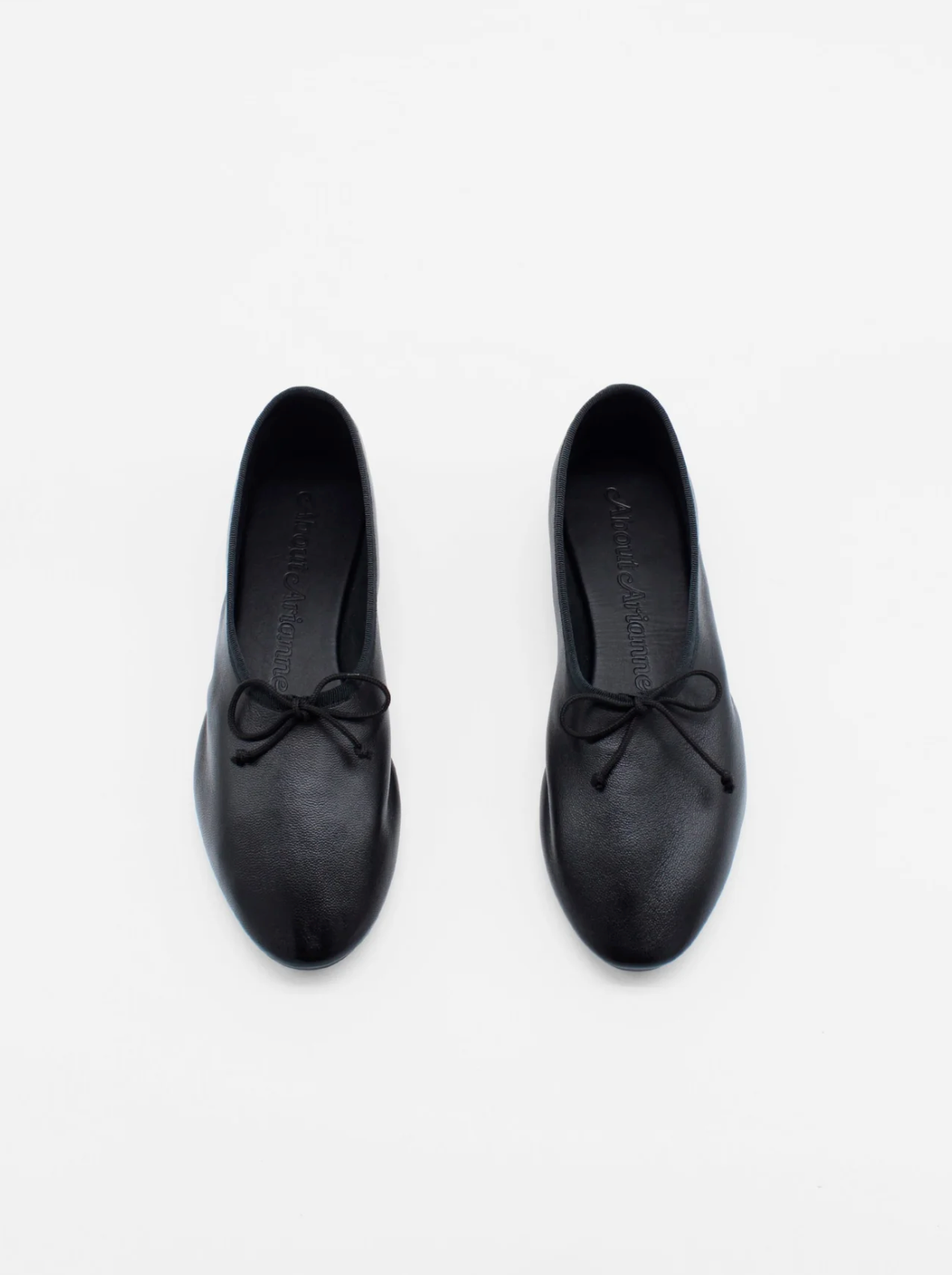 About Arianne Mila Black ballet flats top view