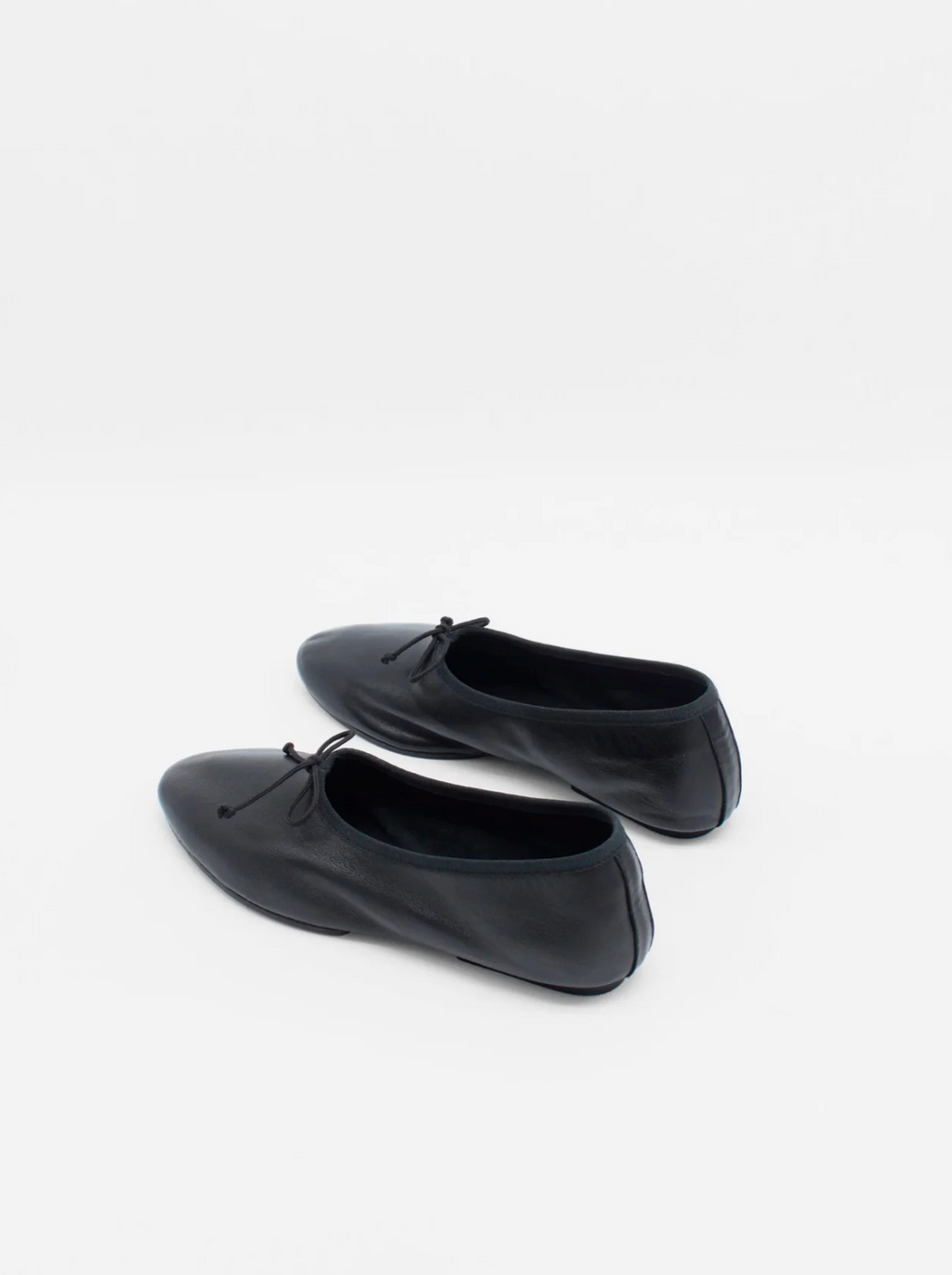 About Arianne Mila Black ballet flats rear view
